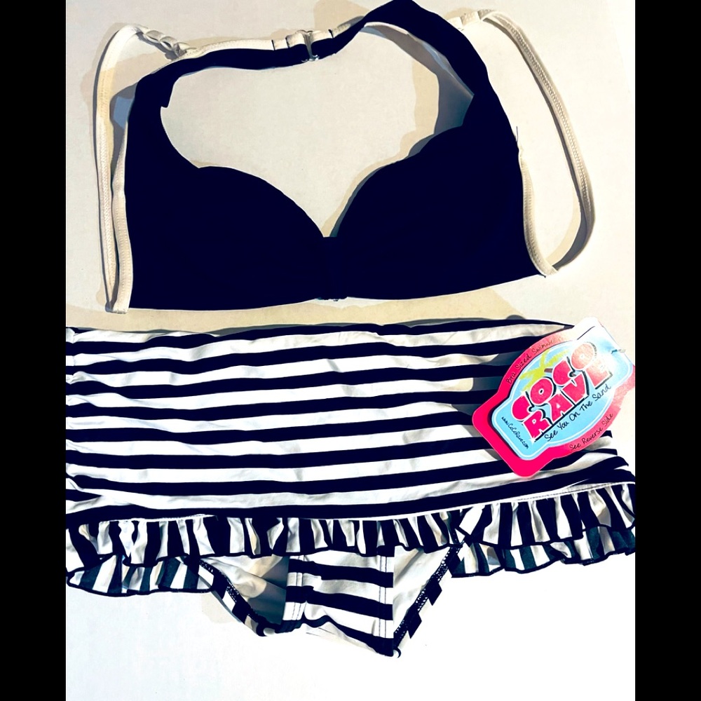 2 piece black & white bikini. Bottom new with tag. Top no tag. Non smoking home.
